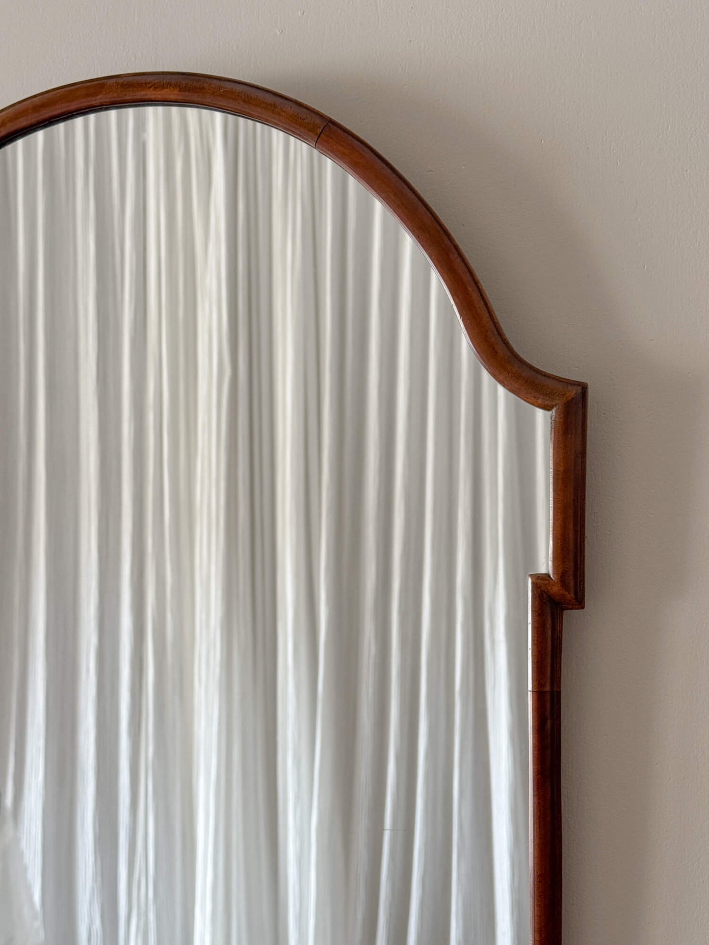 Antique mahogany curved mirror