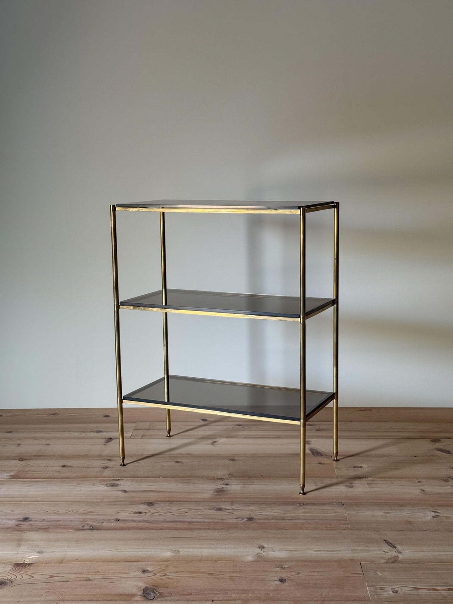 Mid-century brass and smoked glass shelving unit