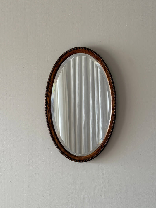 Antique oval oak mirror with bobbin detailing