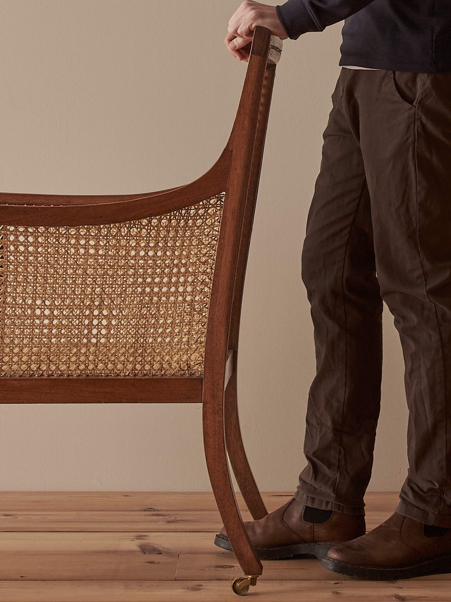 Pair of antique bergère chairs raised on brass castors