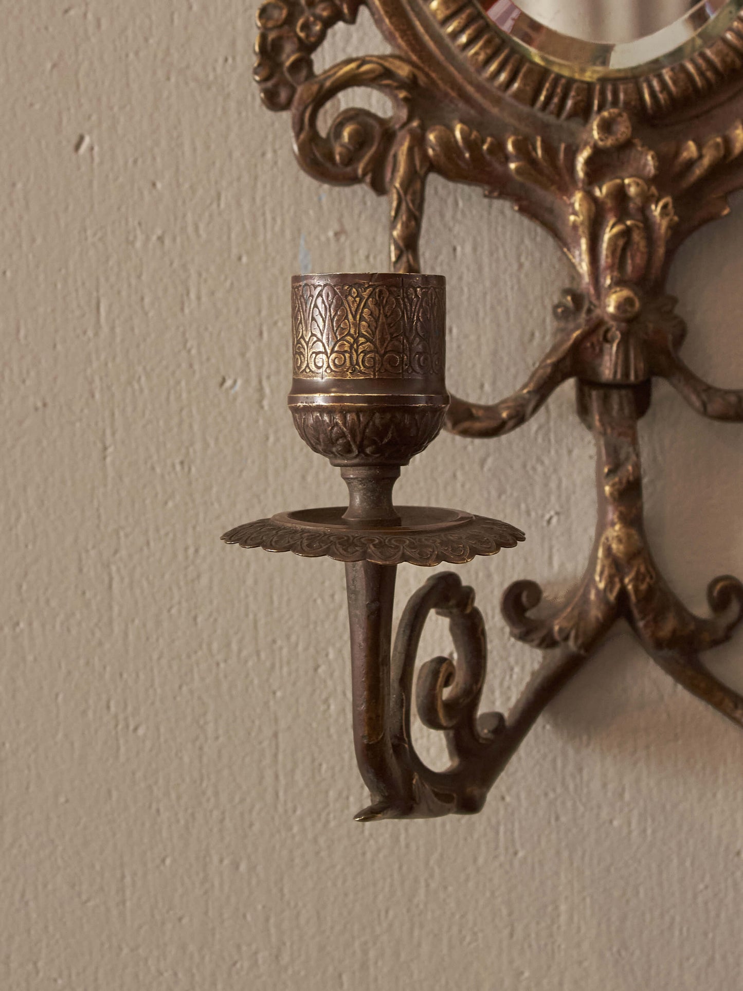 Pair of French antique mirrored brass candle sconces