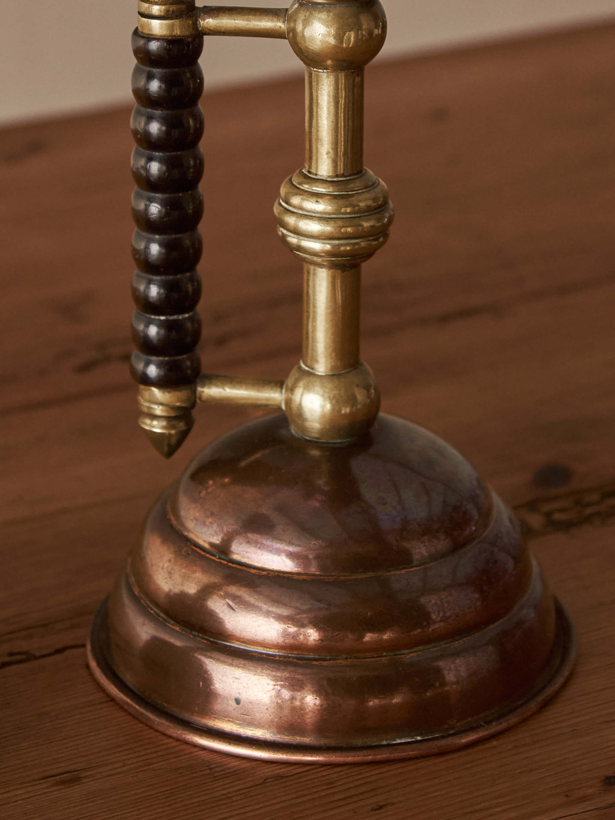 A pair of Arts and Crafts candlesticks by Christopher Dresser