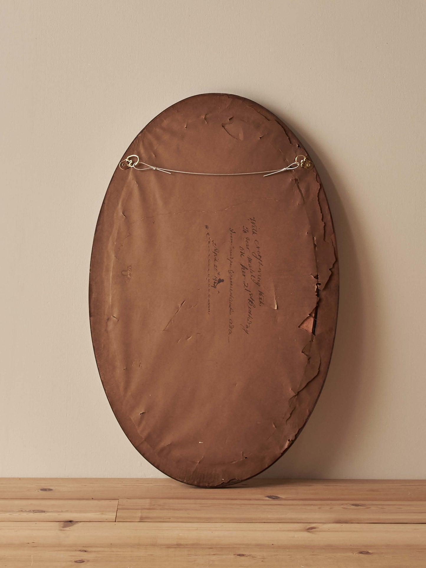 Antique oval walnut mirror with bobbin detailing