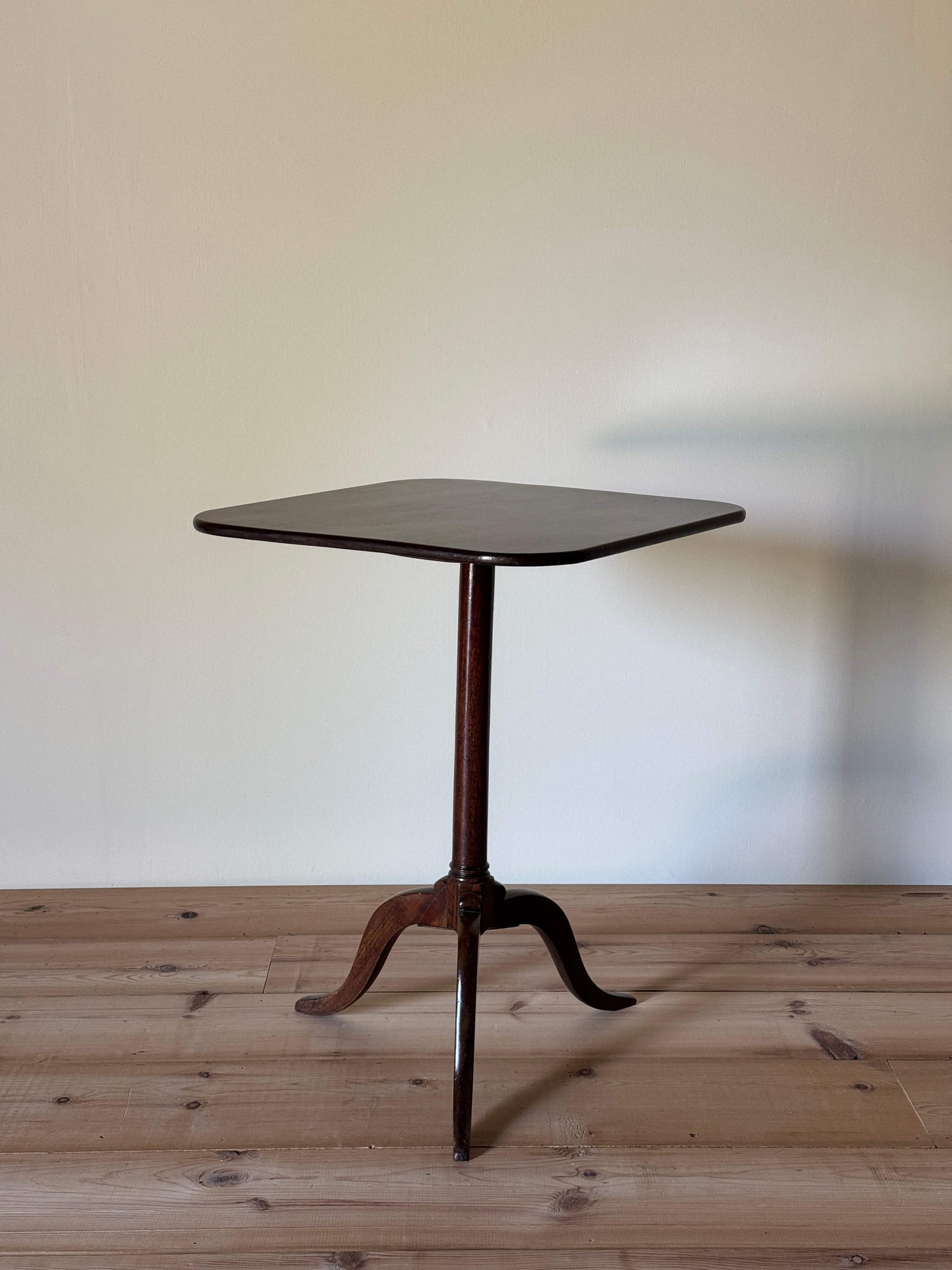 Antique mahogany tilt-top table on splayed legs