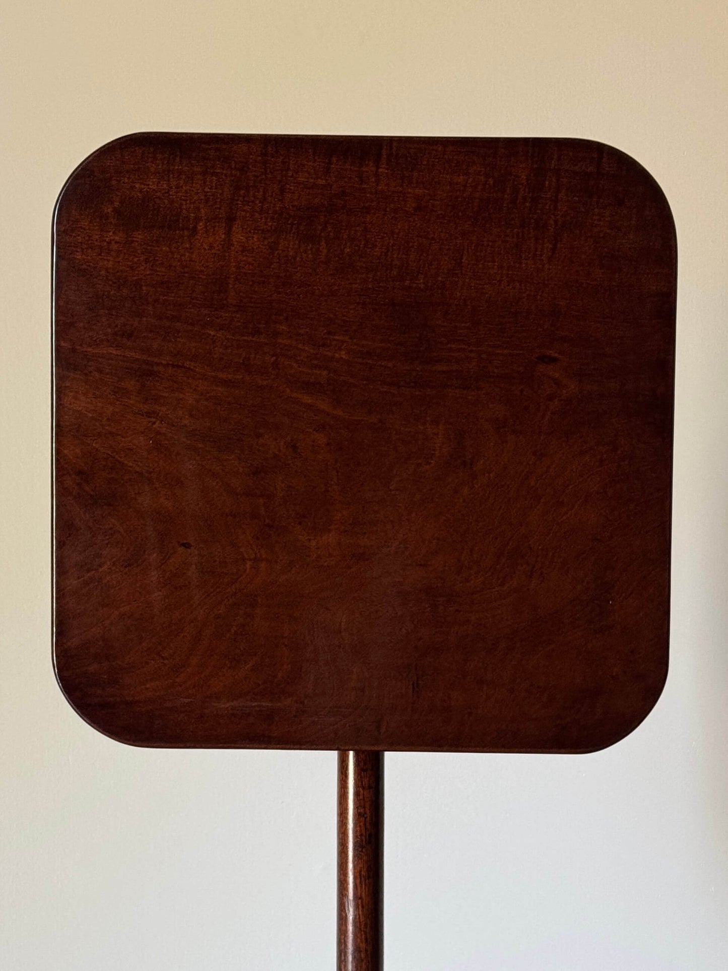 Antique mahogany tilt-top table on splayed legs