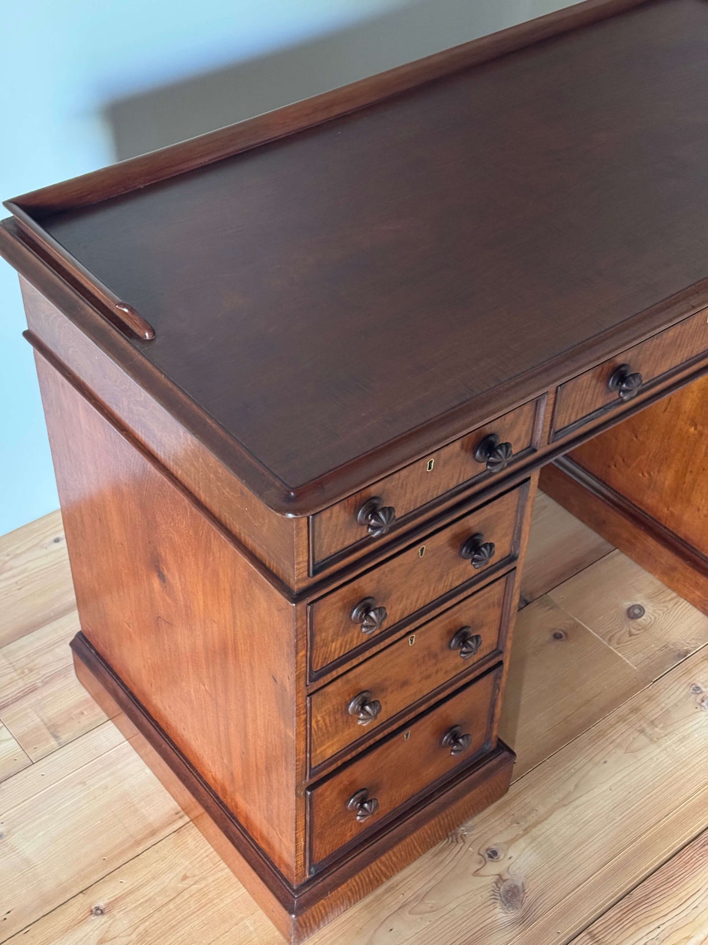 Regency mahogany fiddleback twin pedestal desk
