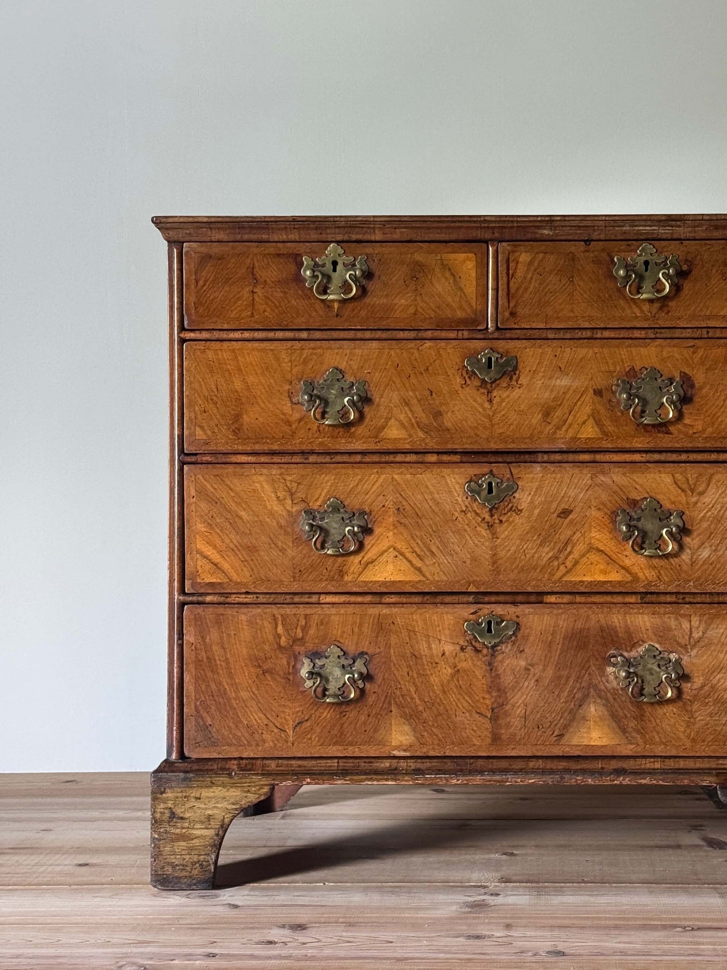 George II walnut crossbanded chest of drawers