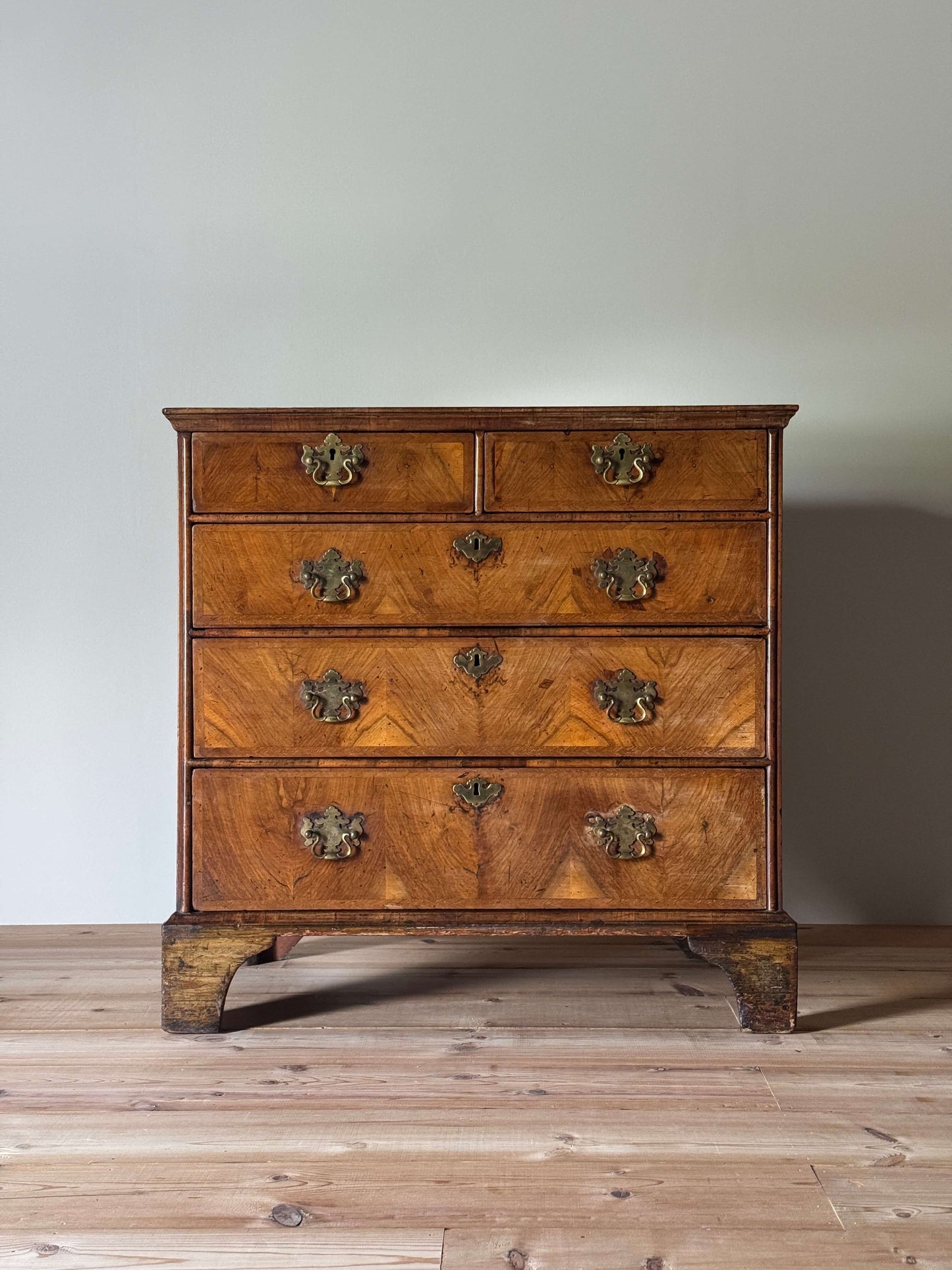George II walnut crossbanded chest of drawers