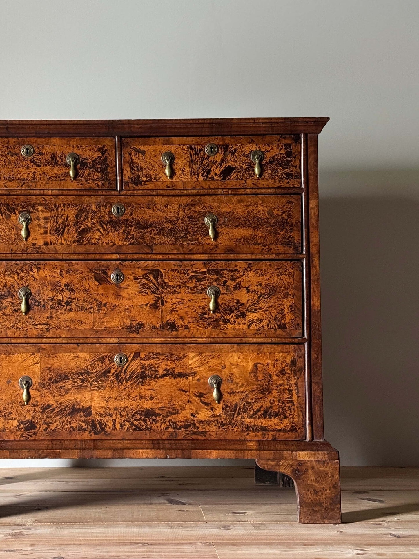 George II walnut and elm crossbanded chest of drawers