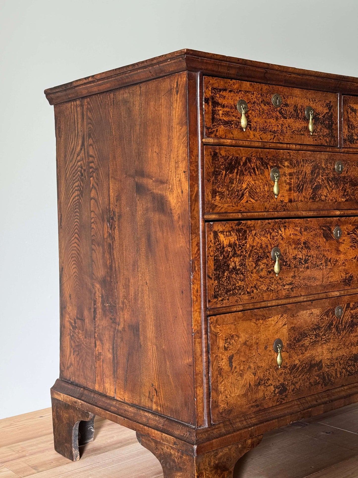 George II walnut and elm crossbanded chest of drawers