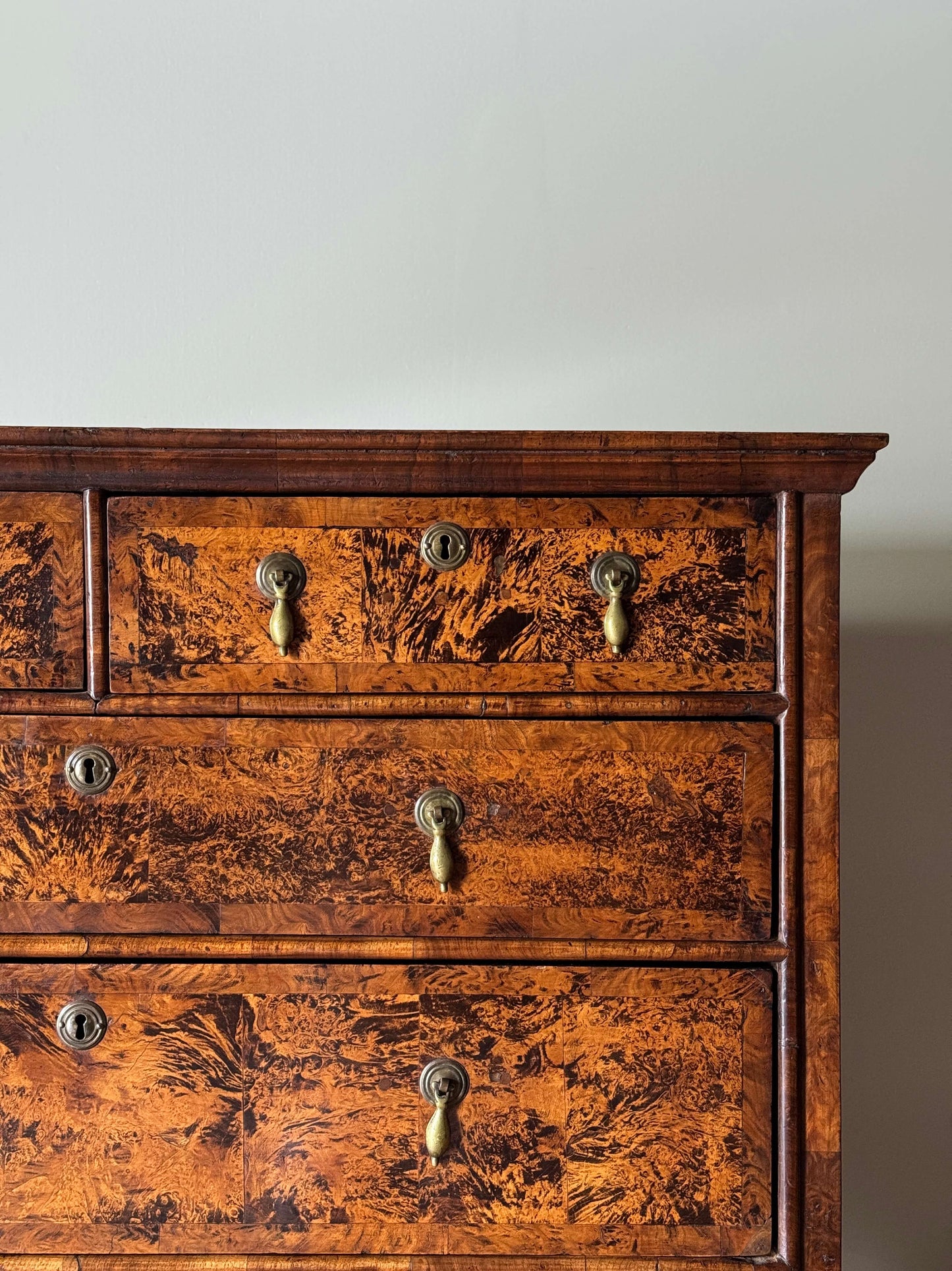 George II walnut and elm crossbanded chest of drawers