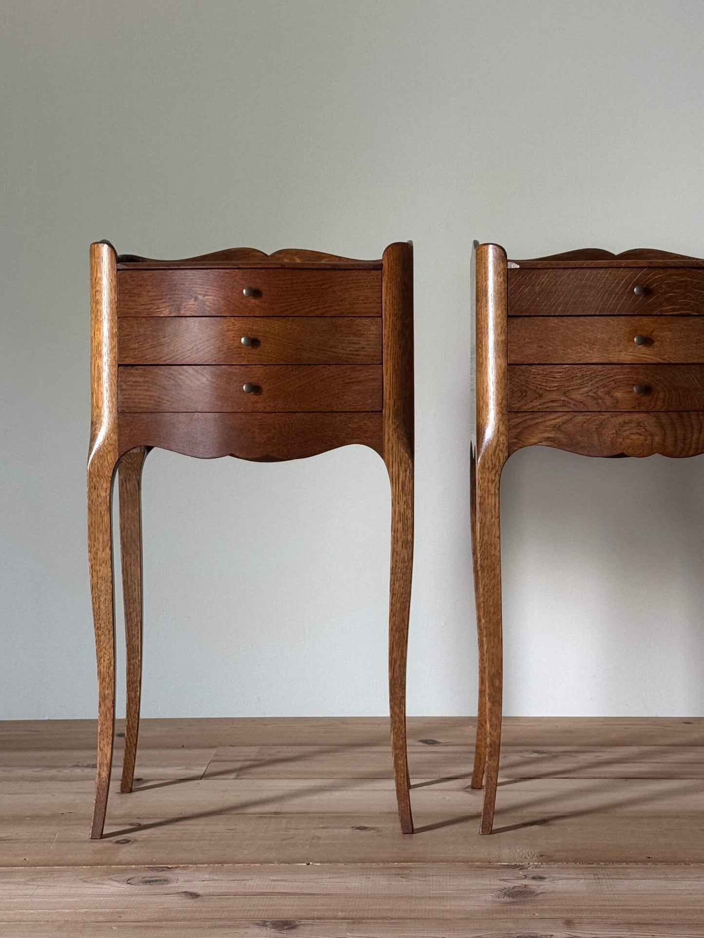 Pair of French bedside tables with three drawers