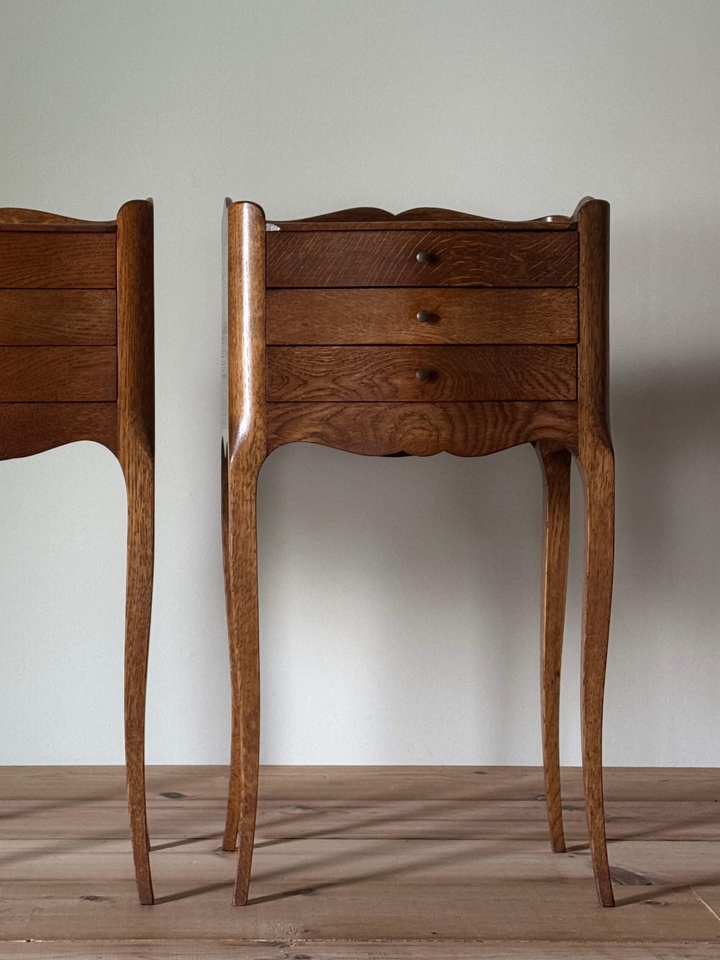 Pair of French bedside tables with three drawers