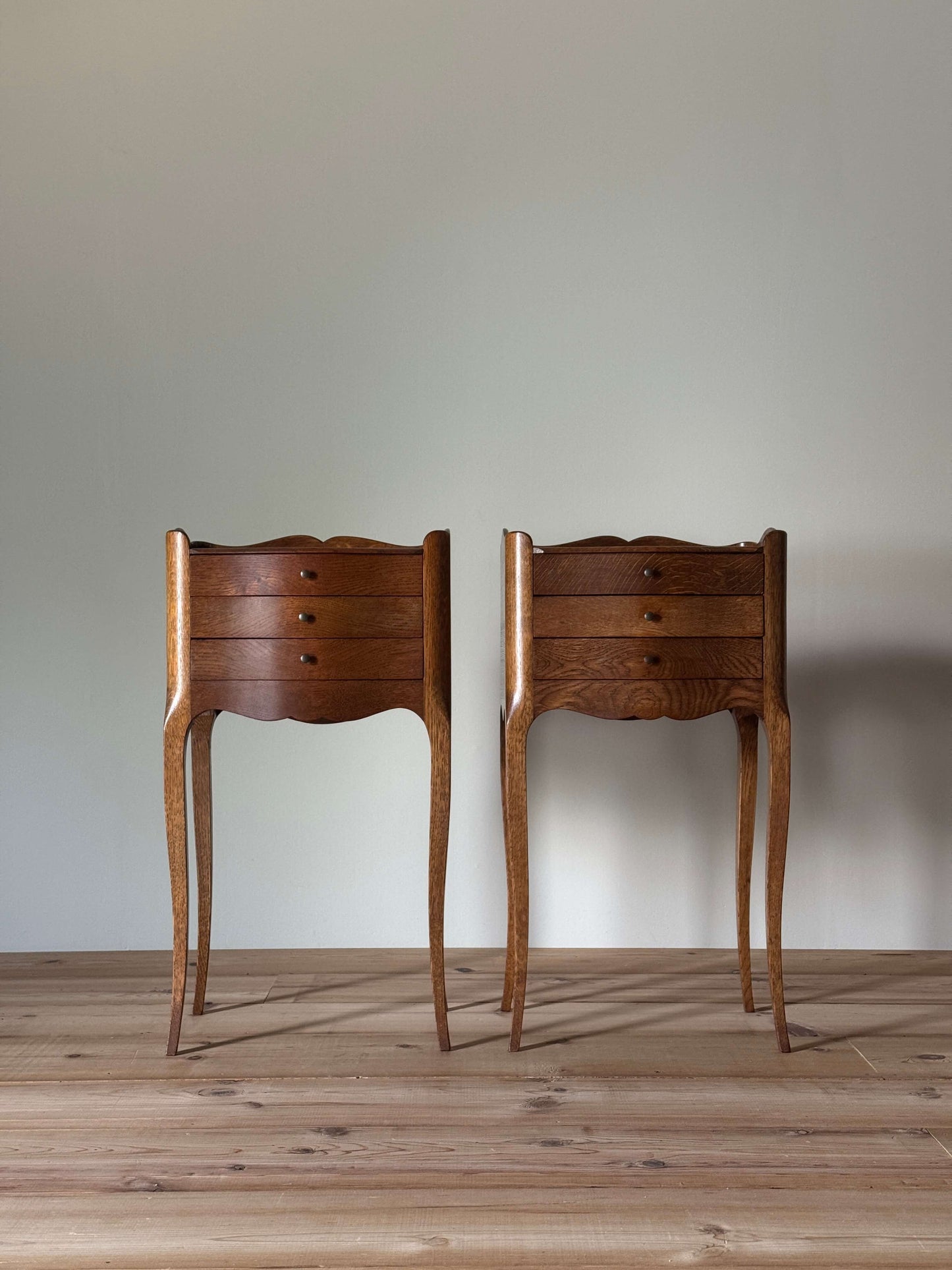 Pair of French bedside tables with three drawers