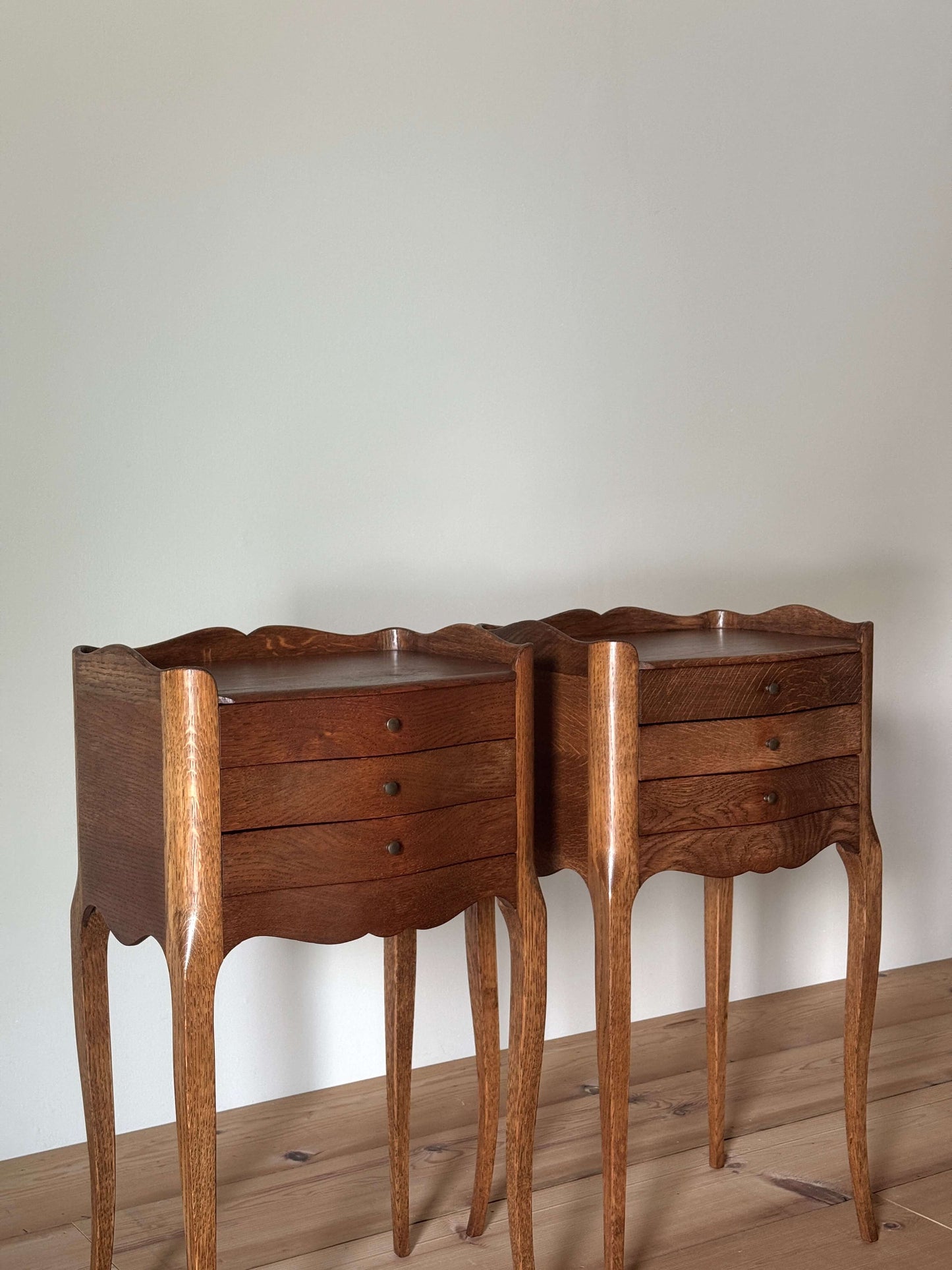 Pair of French bedside tables with three drawers