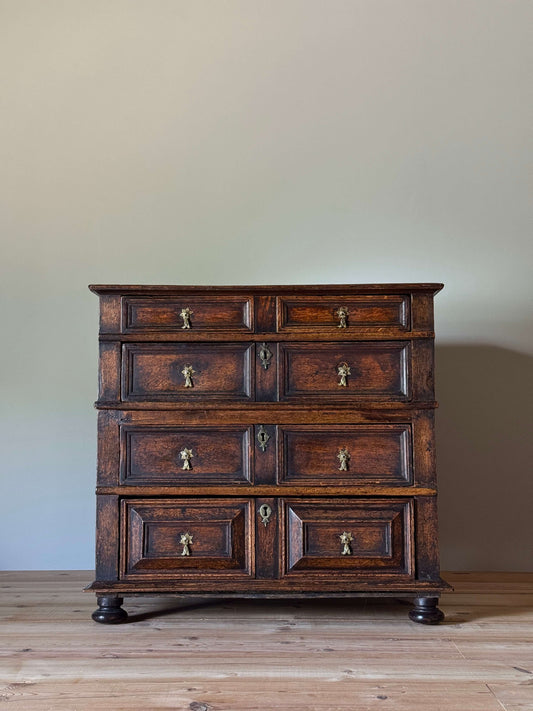 George I oak chest of drawers on bun feet
