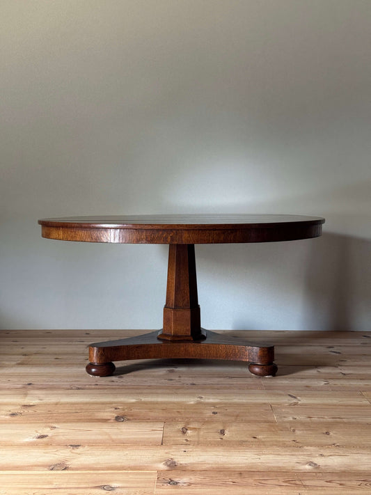 Late Victorian oak dining table on bun feet