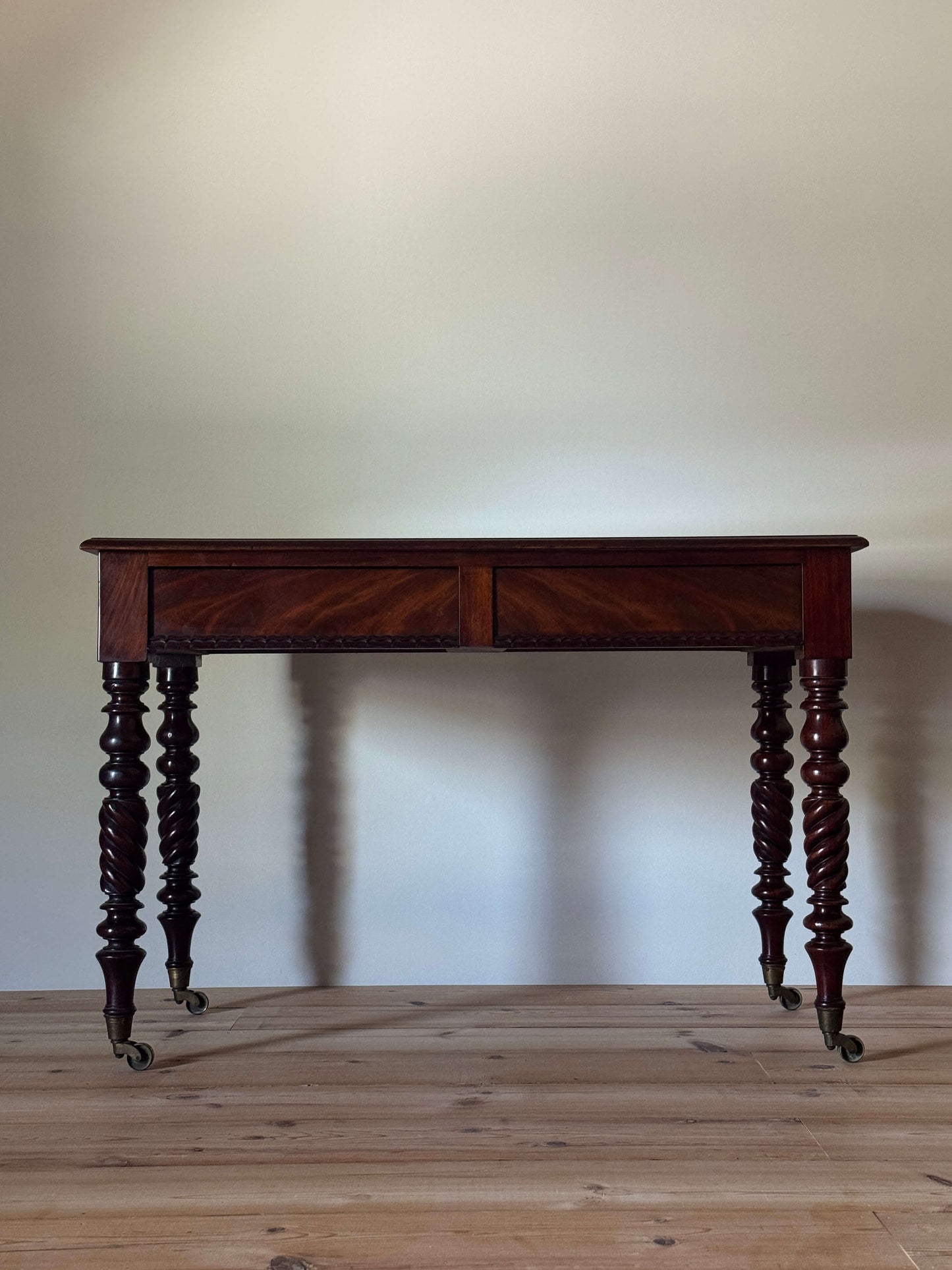 Victorian mahogany console table raised on turned legs