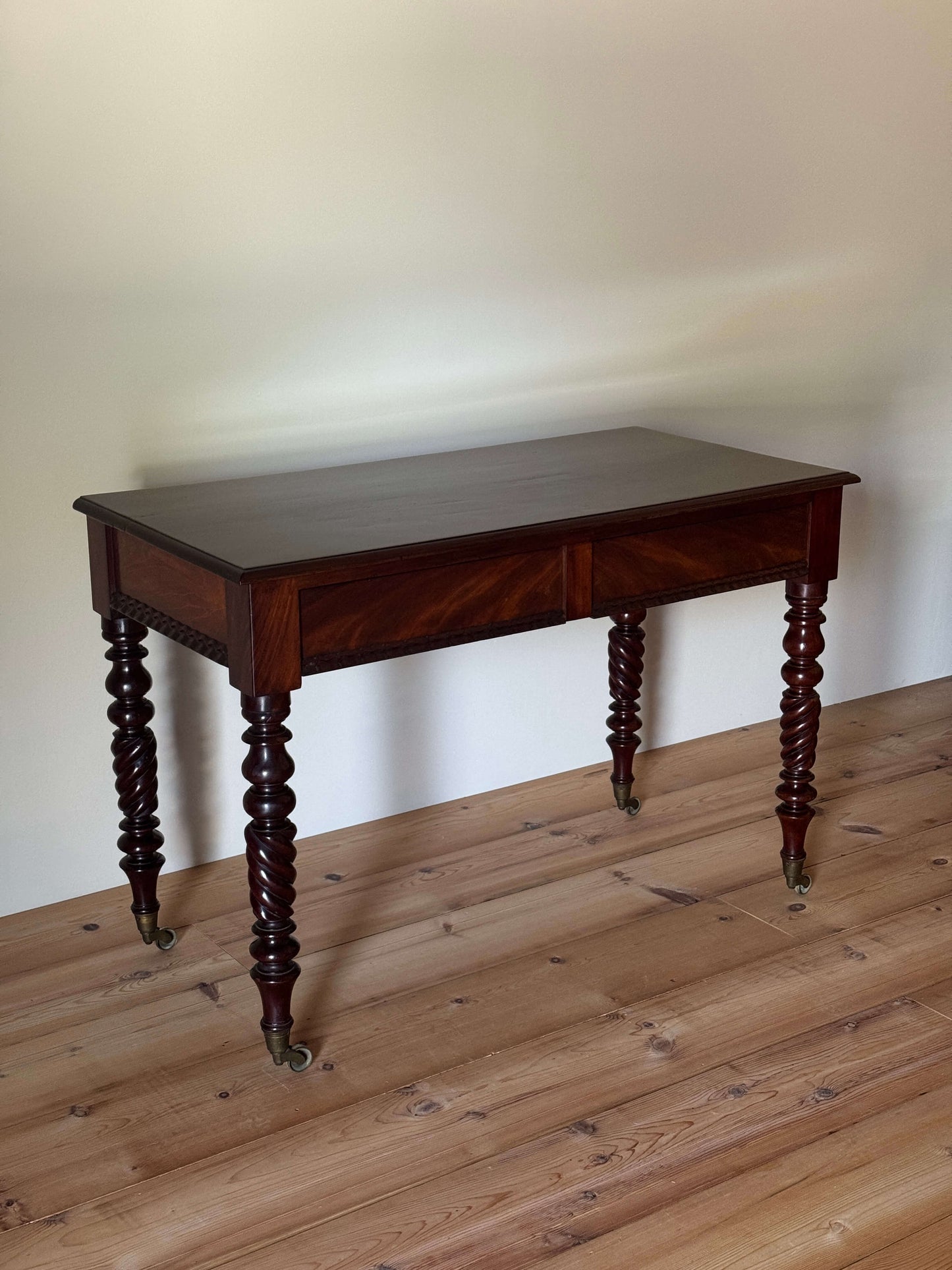 Victorian mahogany console table raised on turned legs