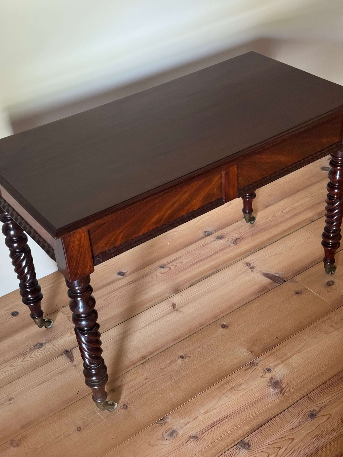 Victorian mahogany console table raised on turned legs