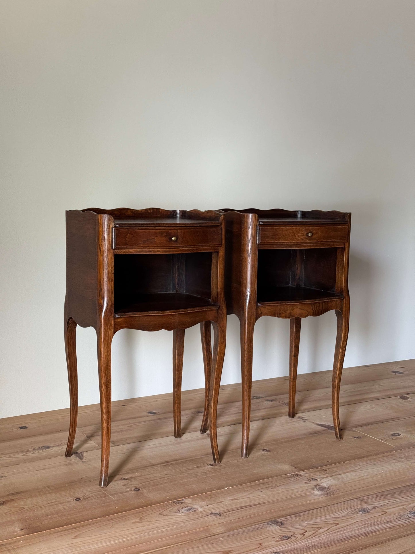 Pair of French mid-century bedside tables with single drawer