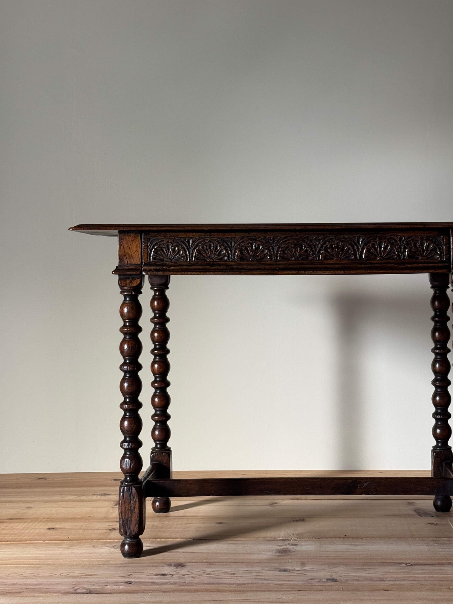 Antique oak console table with carved drawer