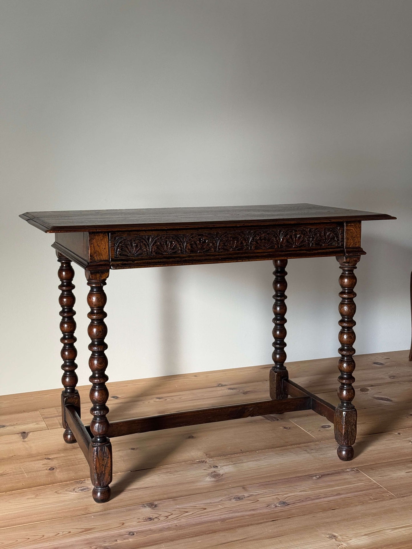 Antique oak console table with carved drawer