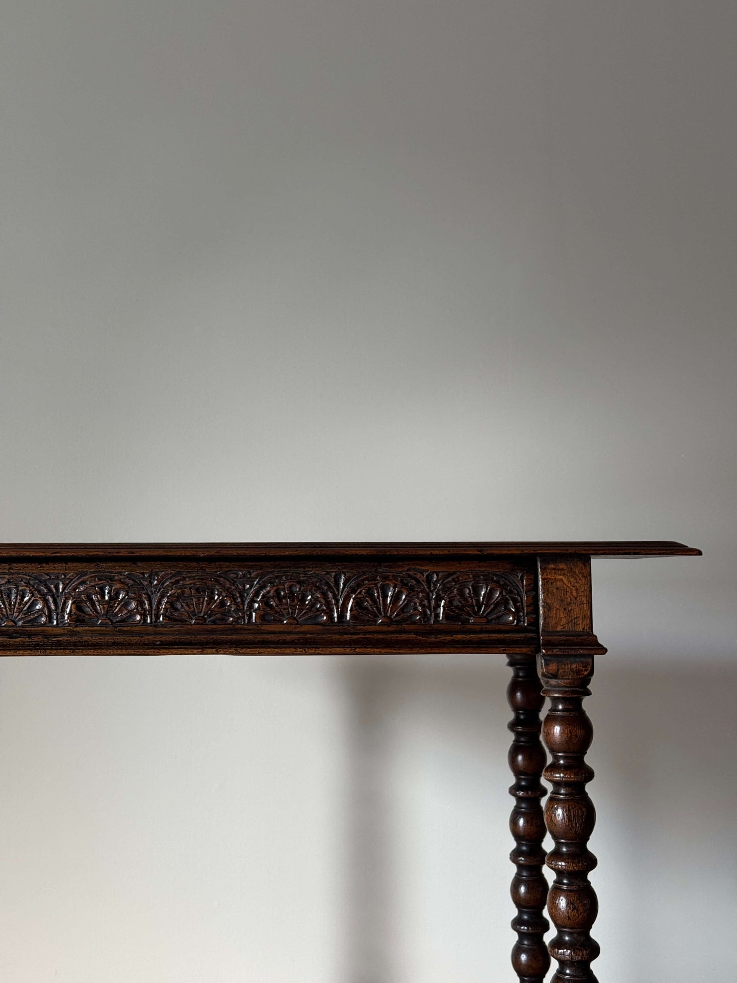 Antique oak console table with carved drawer