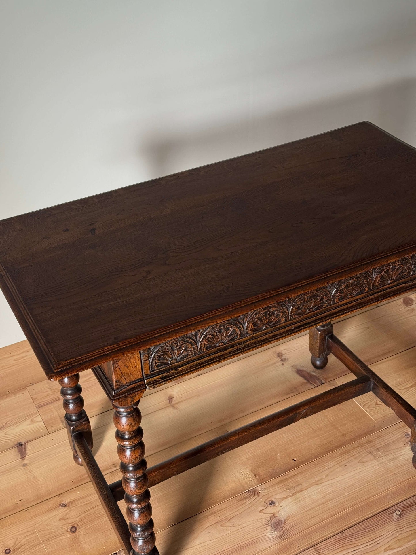 Antique oak console table with carved drawer