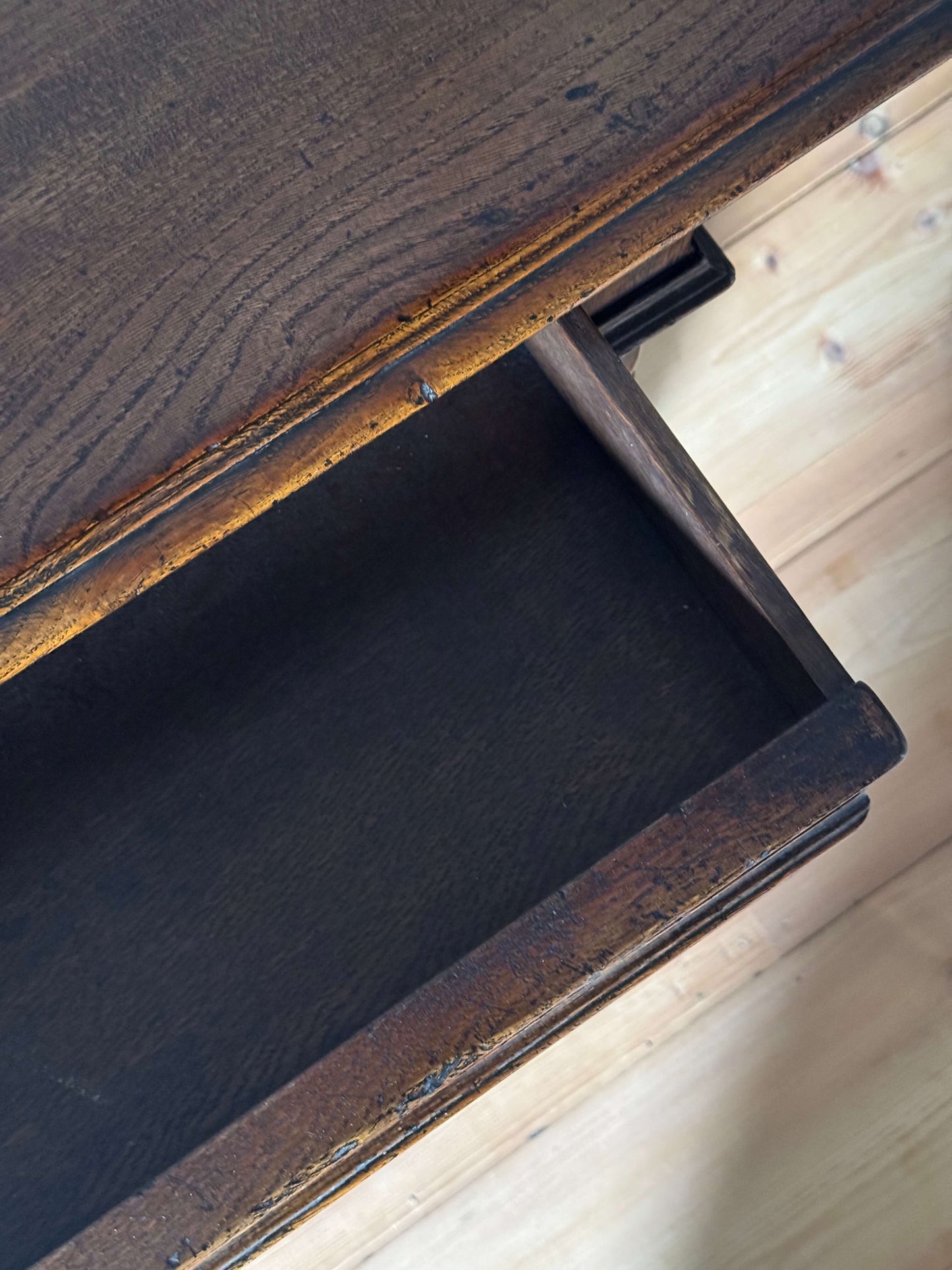 Antique oak console table with carved drawer