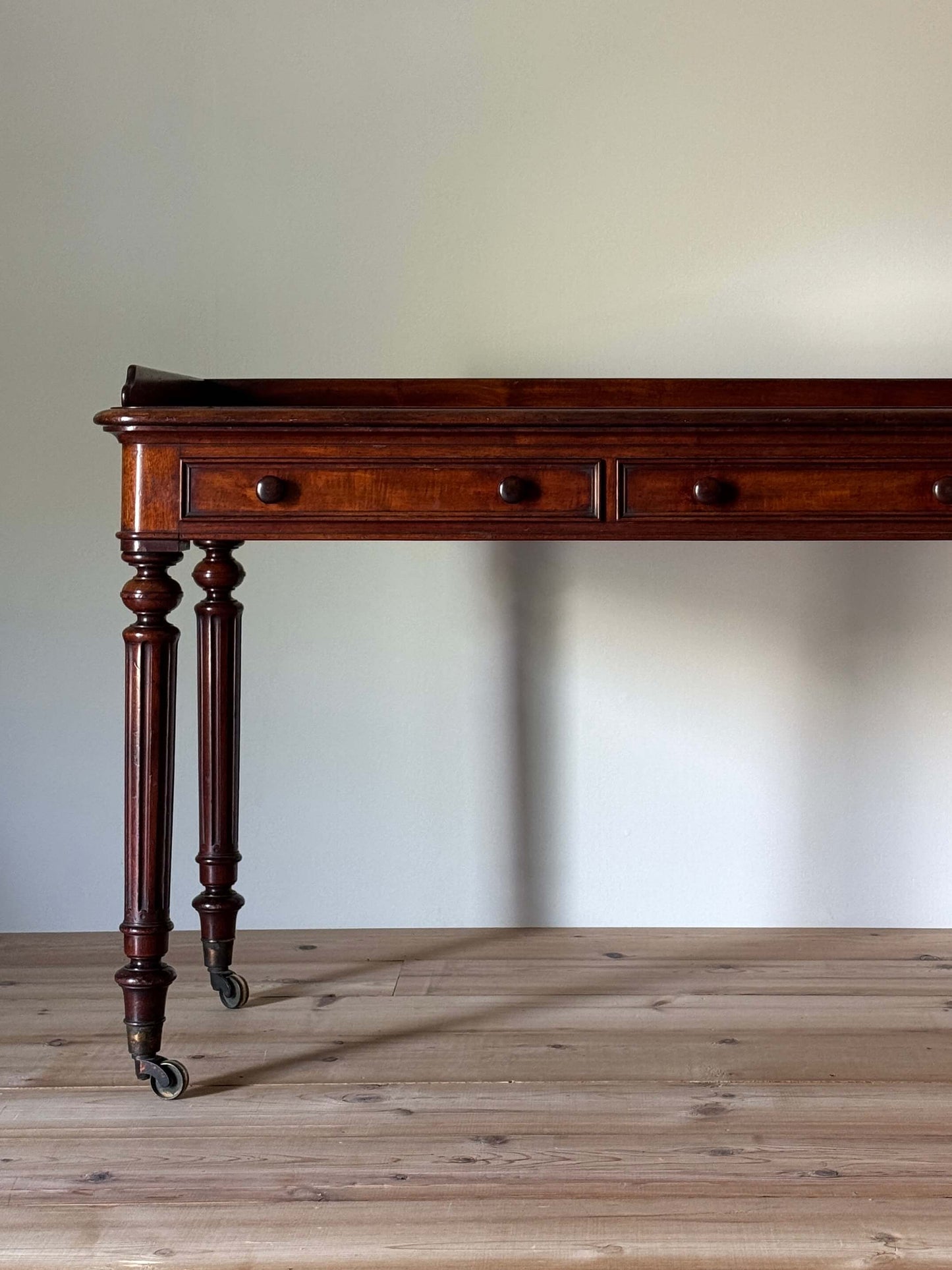 Victorian mahogany desk raised on fluted legs