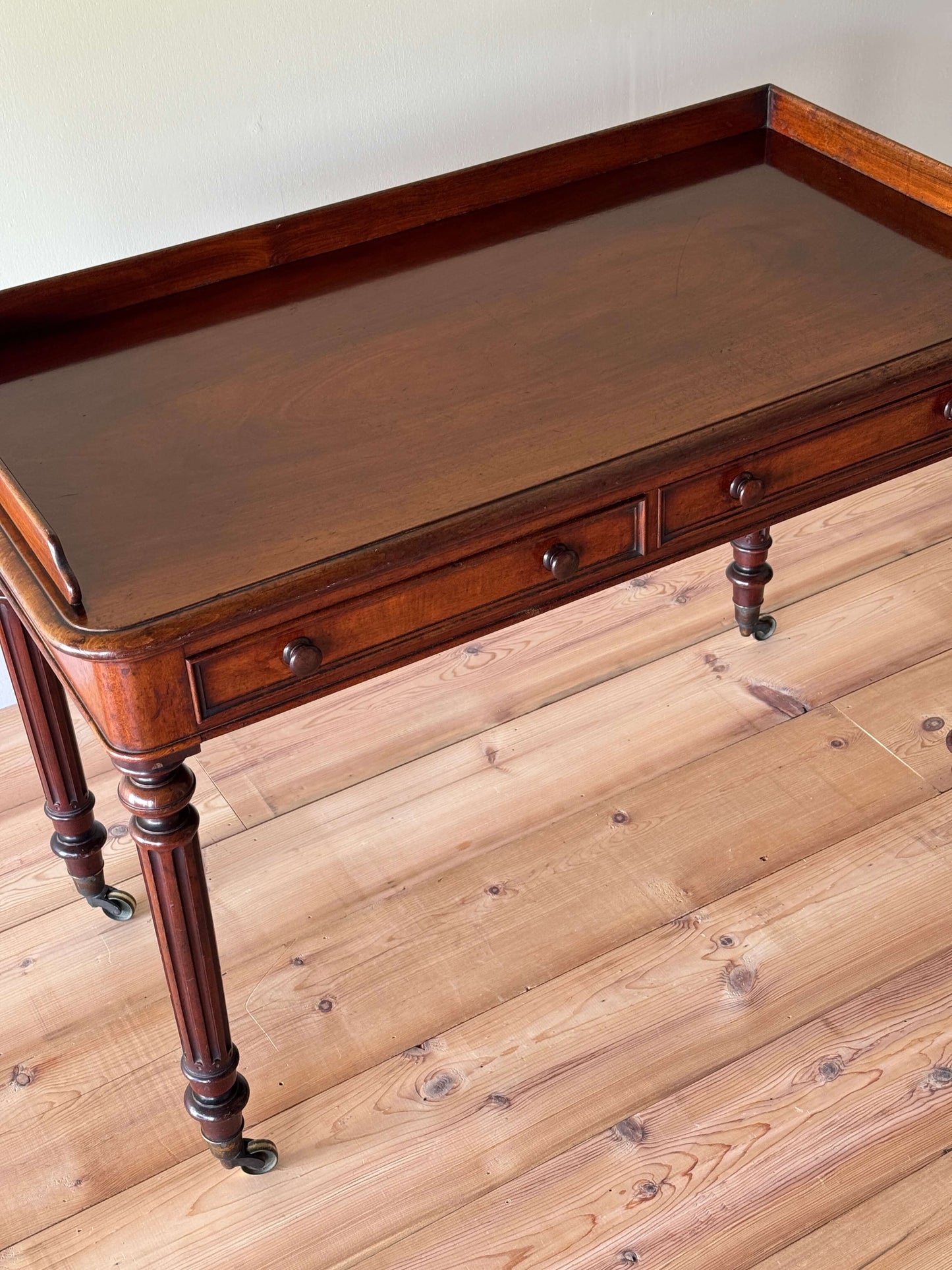 Victorian mahogany desk raised on fluted legs