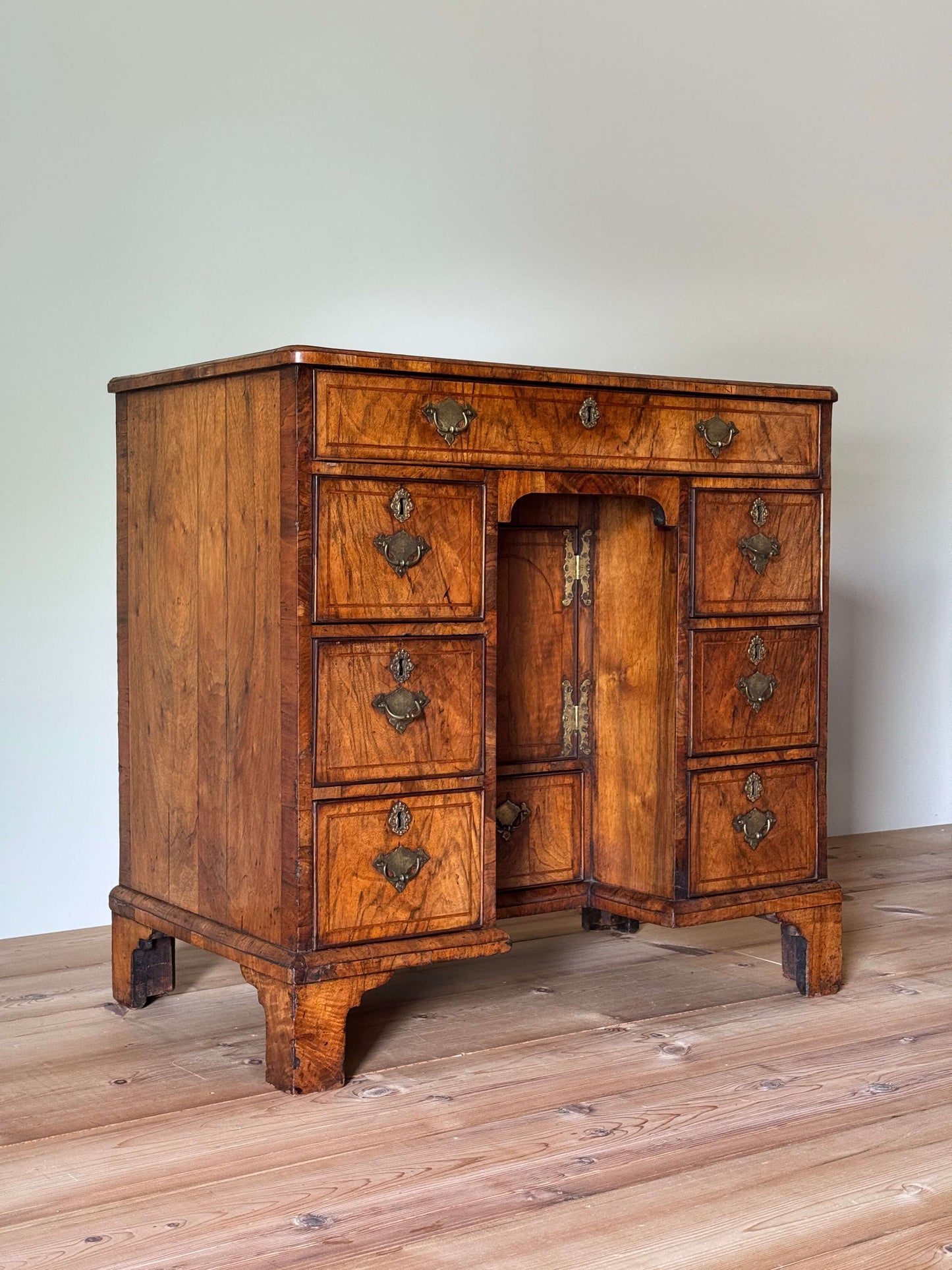 George II walnut cross-banded kneehole desk
