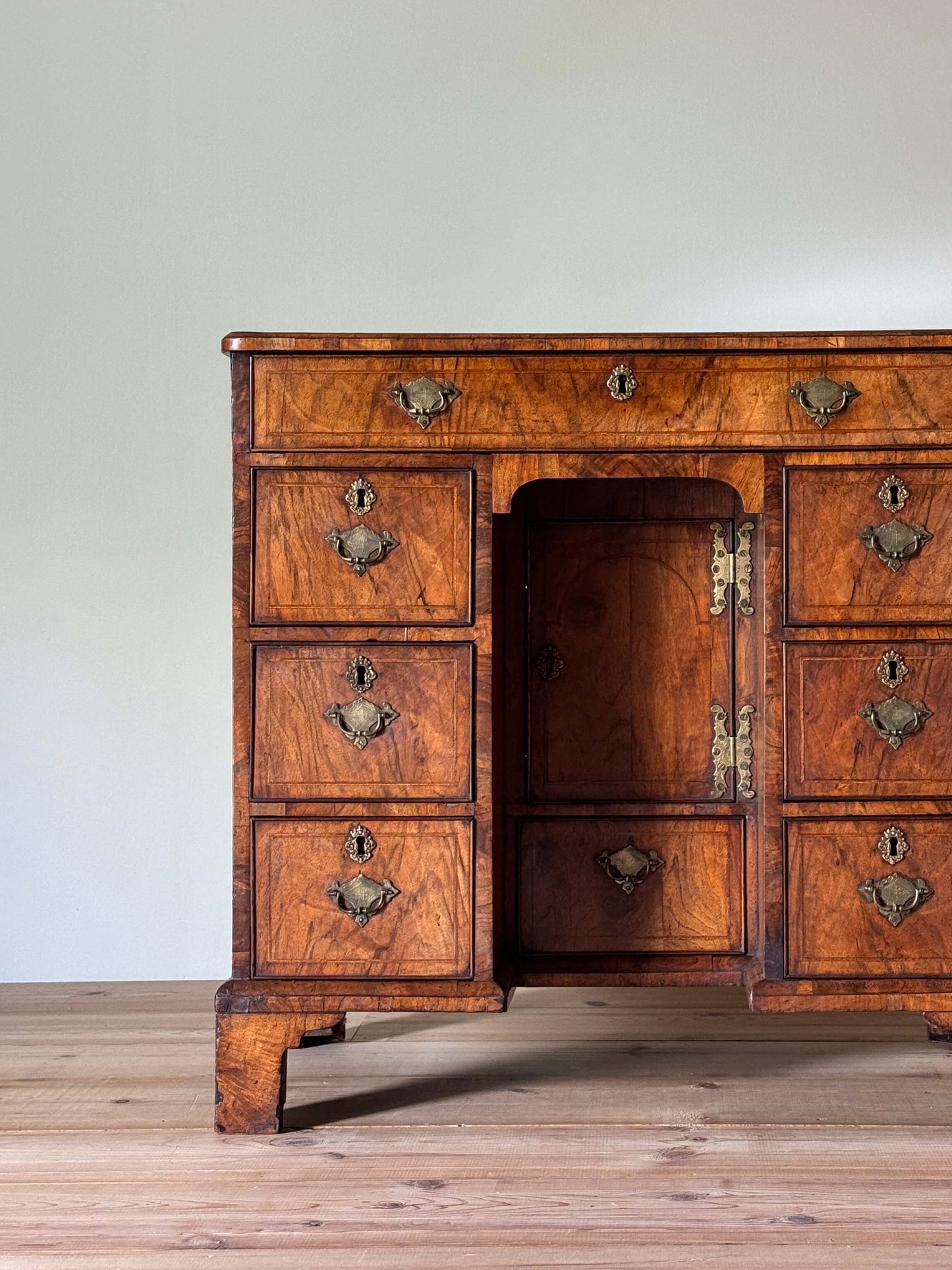 George II walnut cross-banded kneehole desk