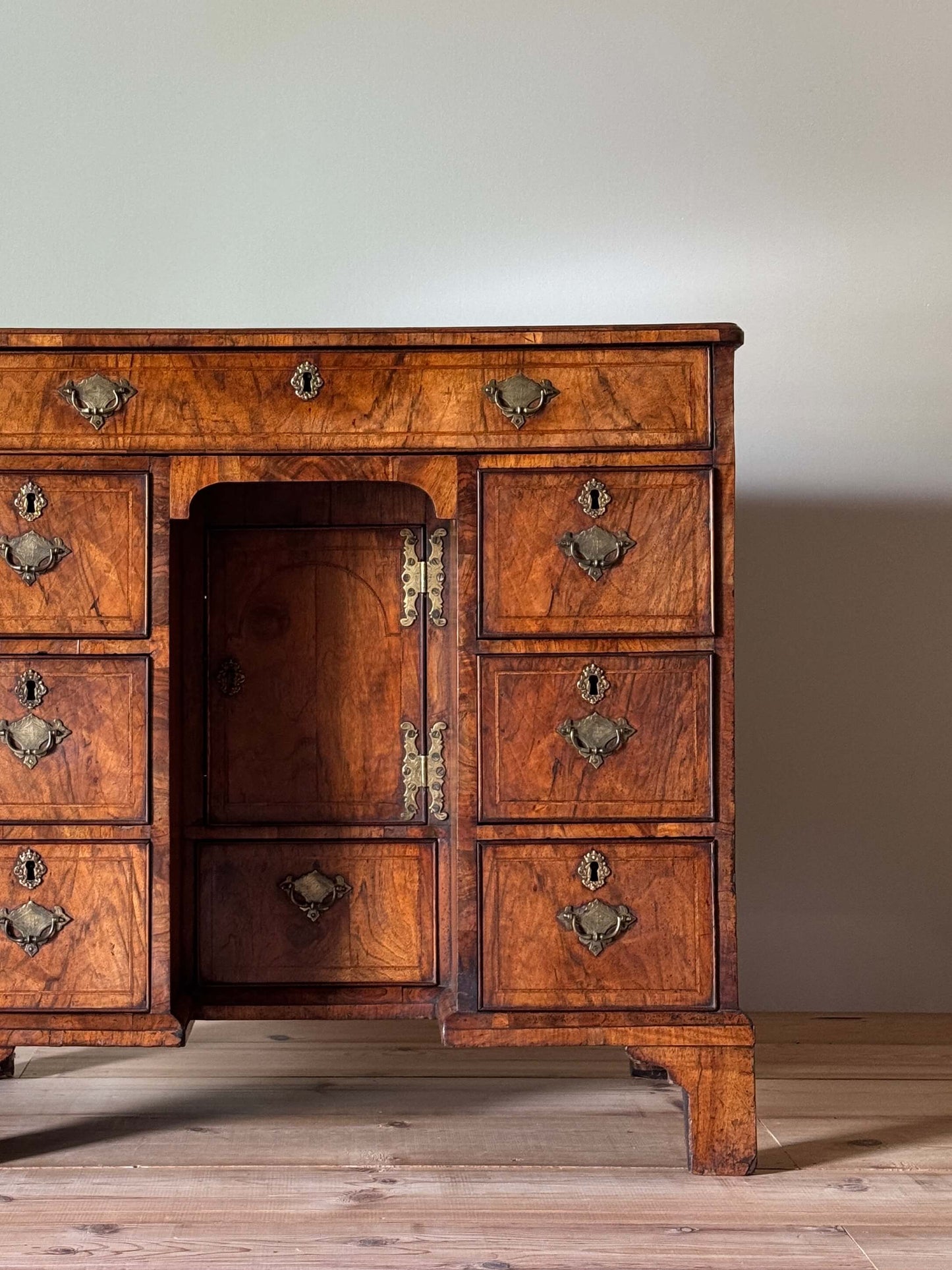 George II walnut cross-banded kneehole desk