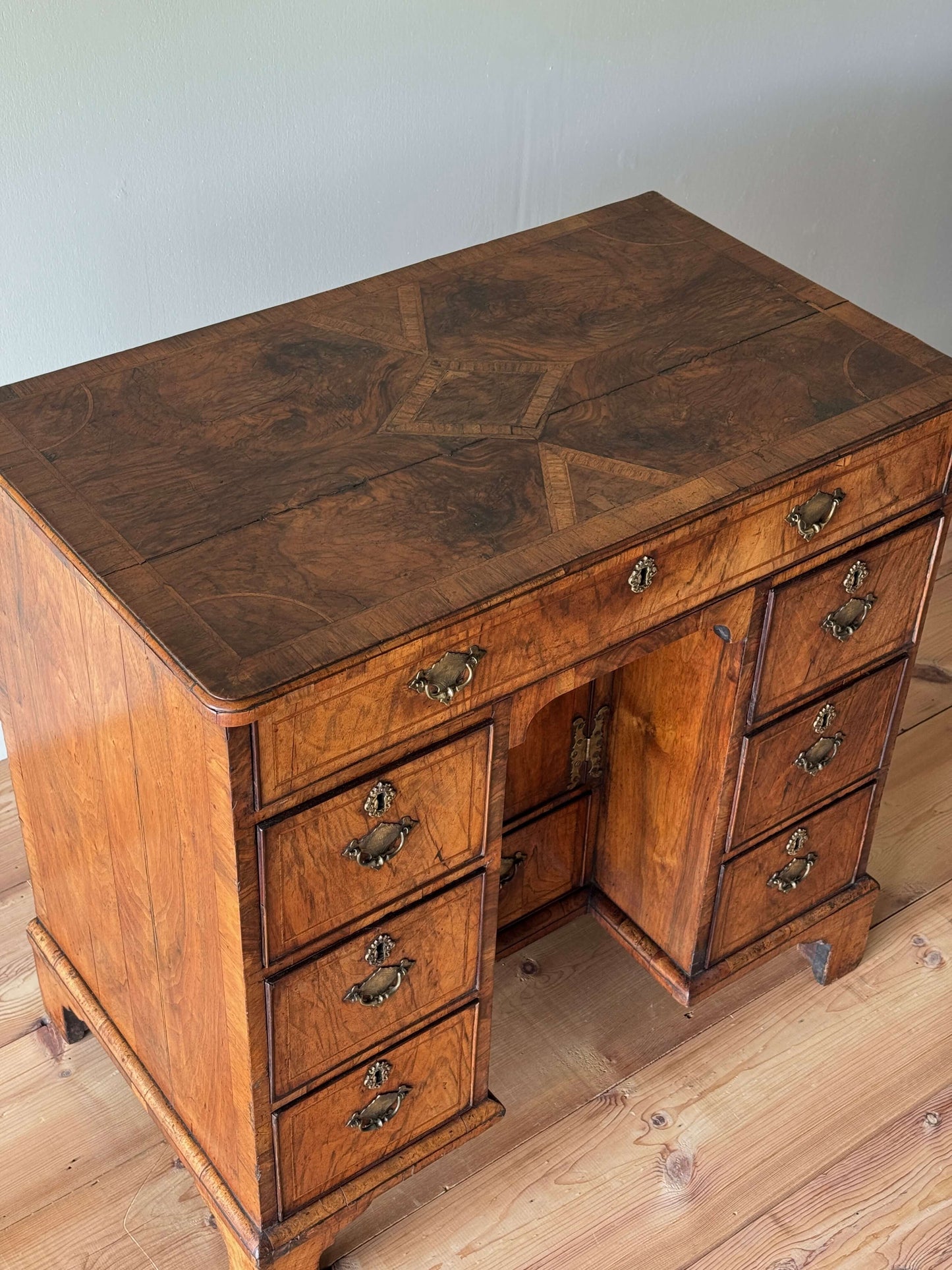 George II walnut cross-banded kneehole desk