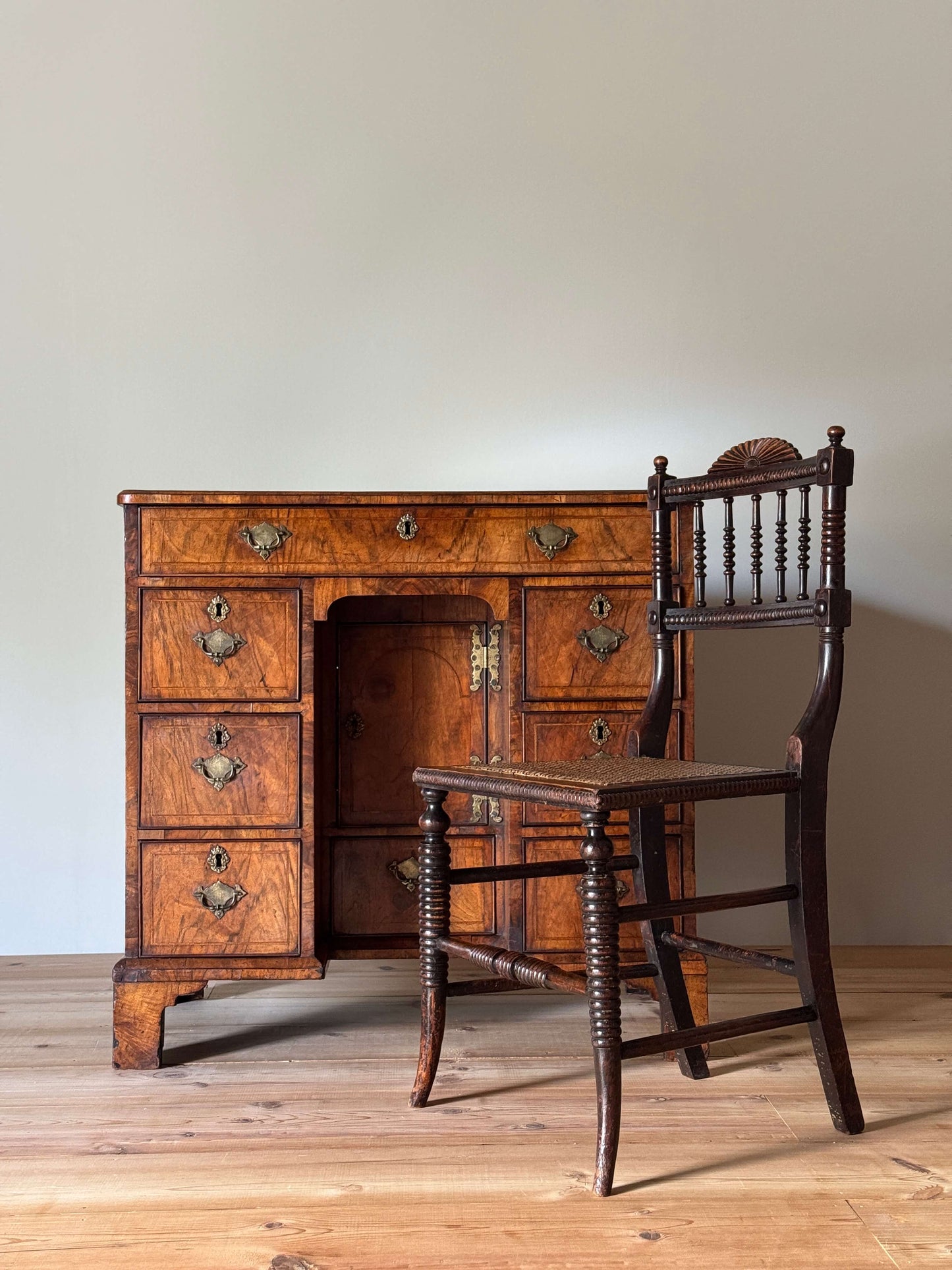 George II walnut cross-banded kneehole desk