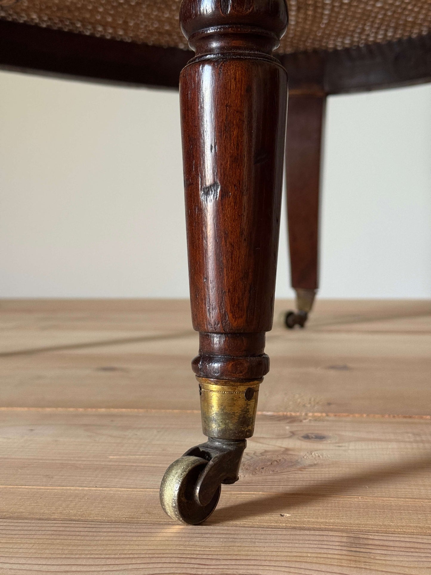 Antique beech bergere chair on castors