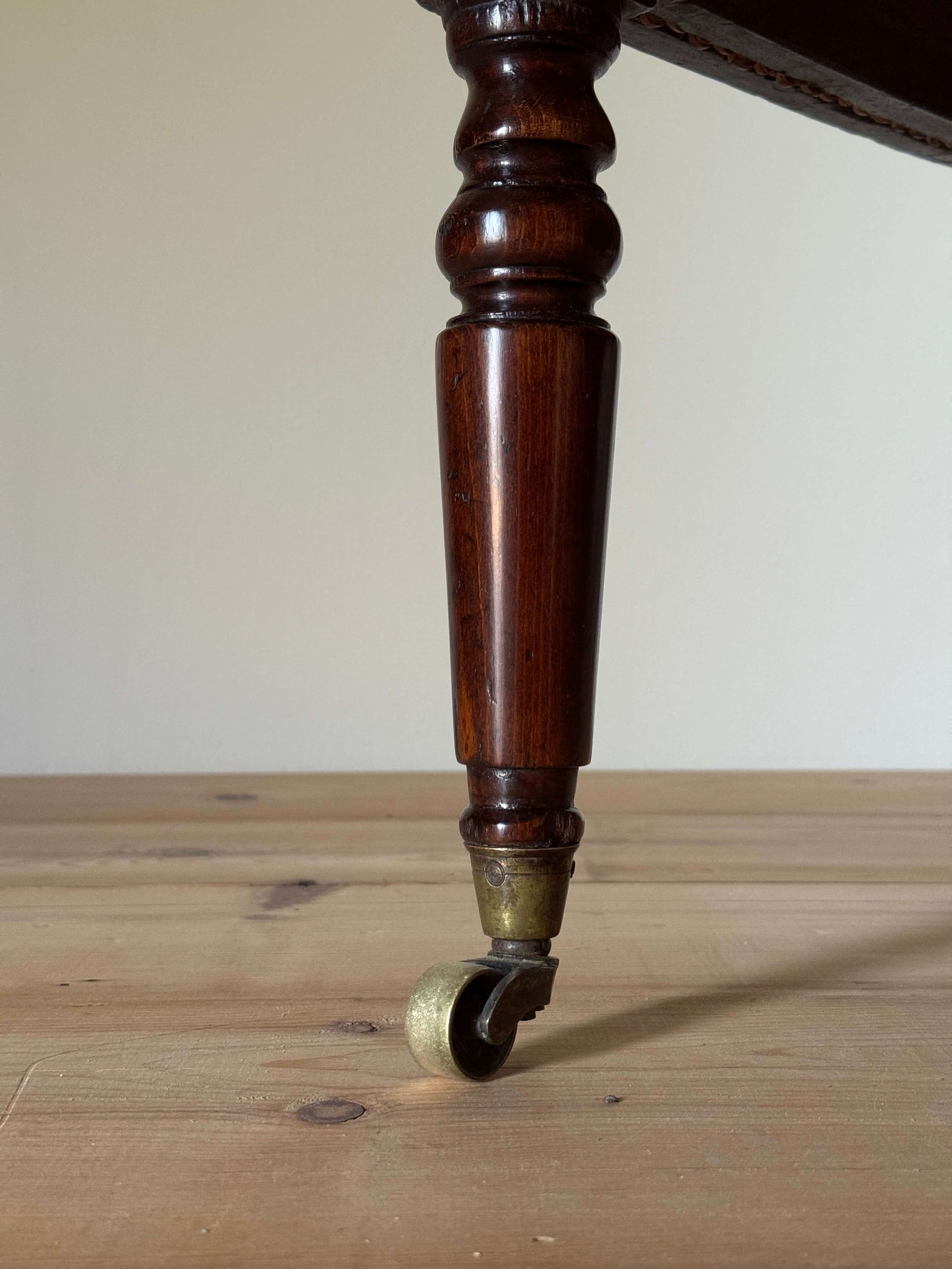 Antique beech bergere chair on castors