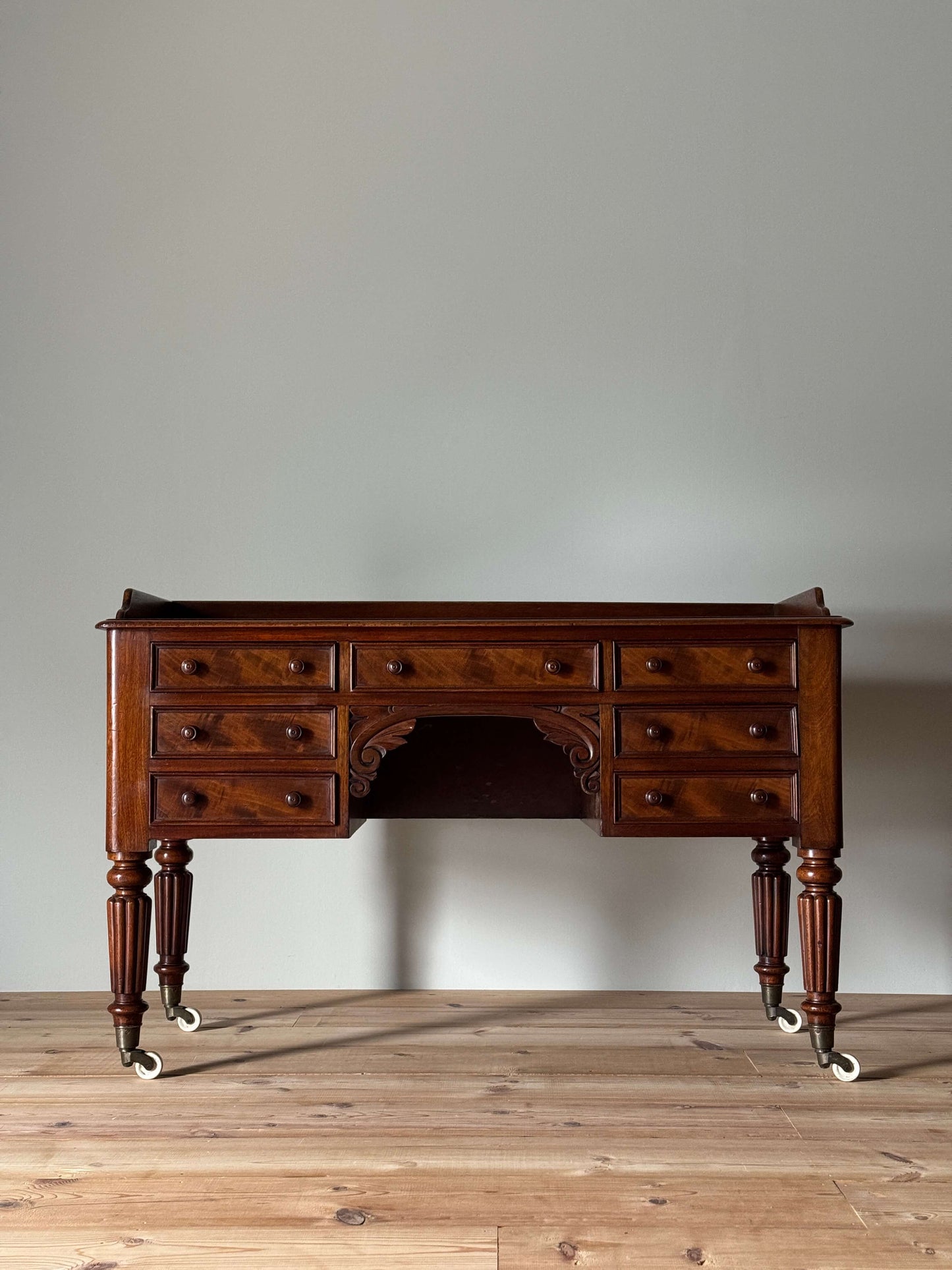 Victorian mahogany desk on castors by T.H.Filmer