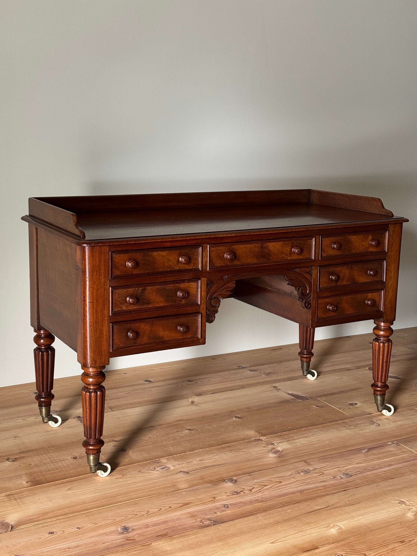 Victorian mahogany desk on castors by T.H.Filmer