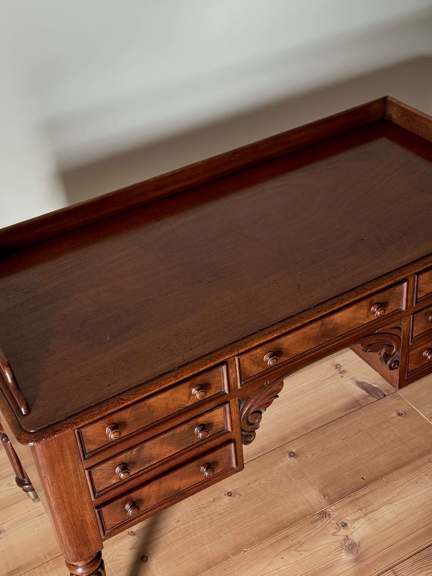Victorian mahogany desk on castors by T.H.Filmer