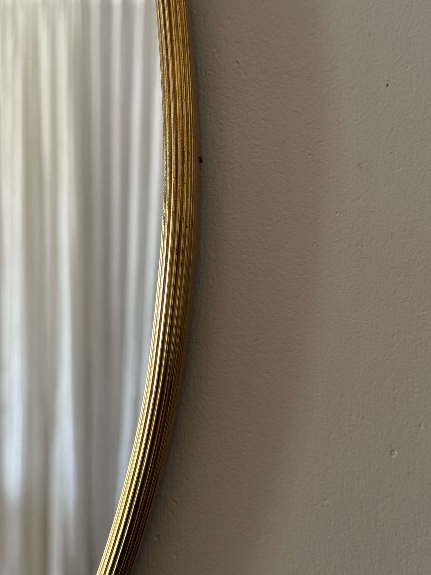 French mid-century oval brass mirror