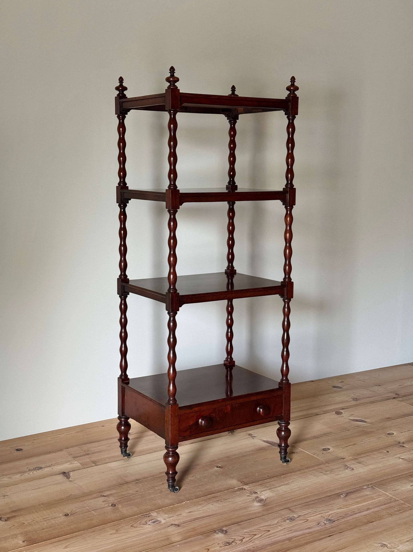Victorian mahogany bobbin whatnot on castors