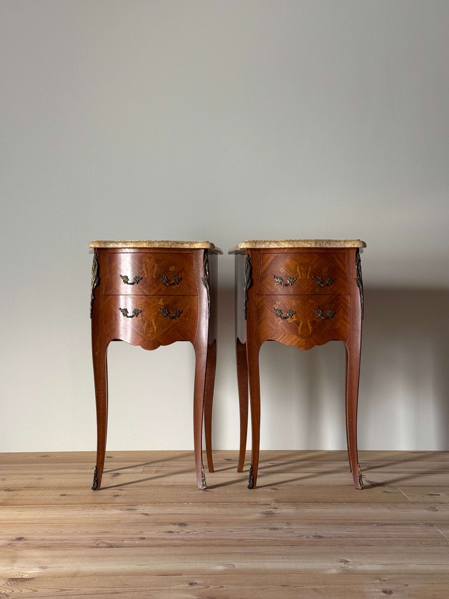 Pair of French 20th-century bedside tables with marble tops