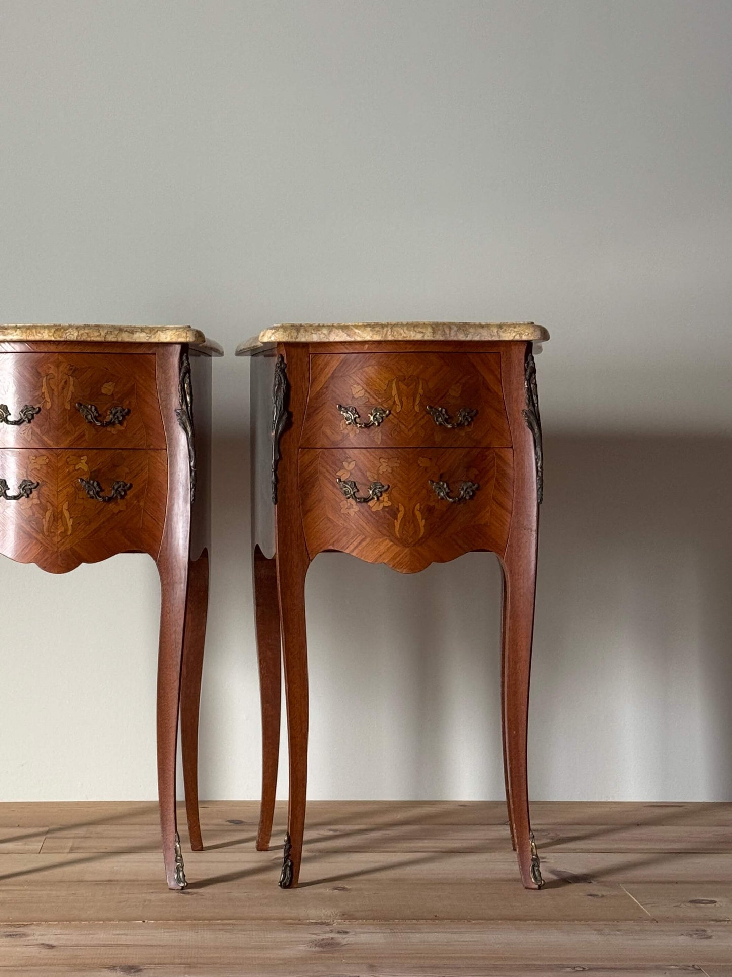 Pair of French 20th-century bedside tables with marble tops