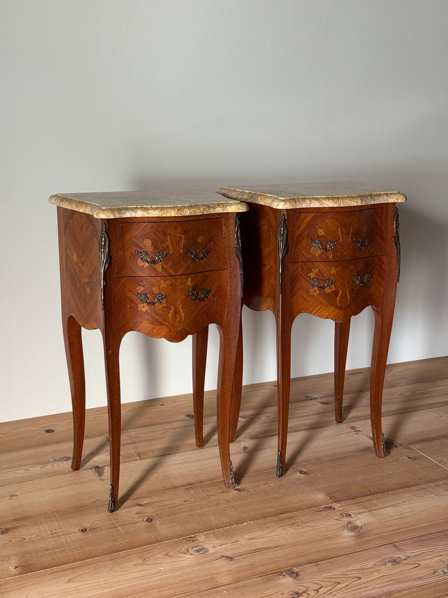 Pair of French 20th-century bedside tables with marble tops