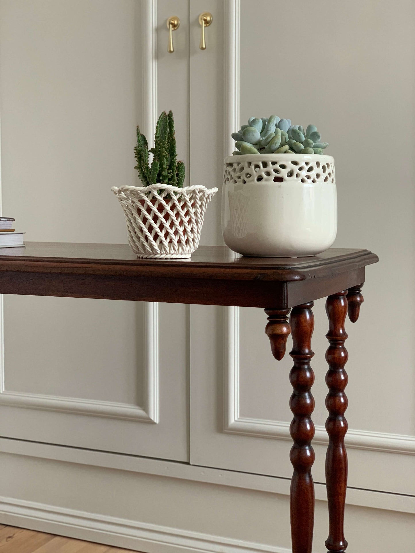 Antique bobbin console table on casters