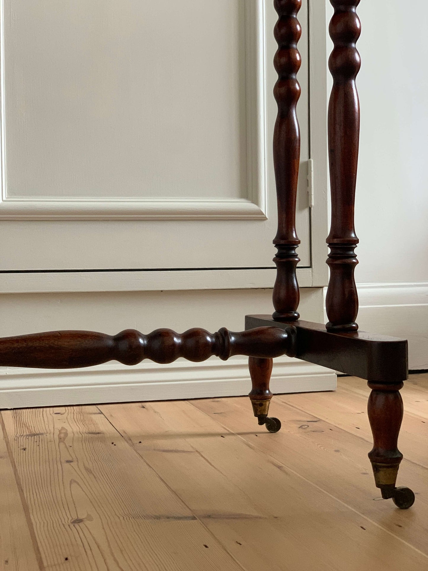 Antique bobbin console table on casters