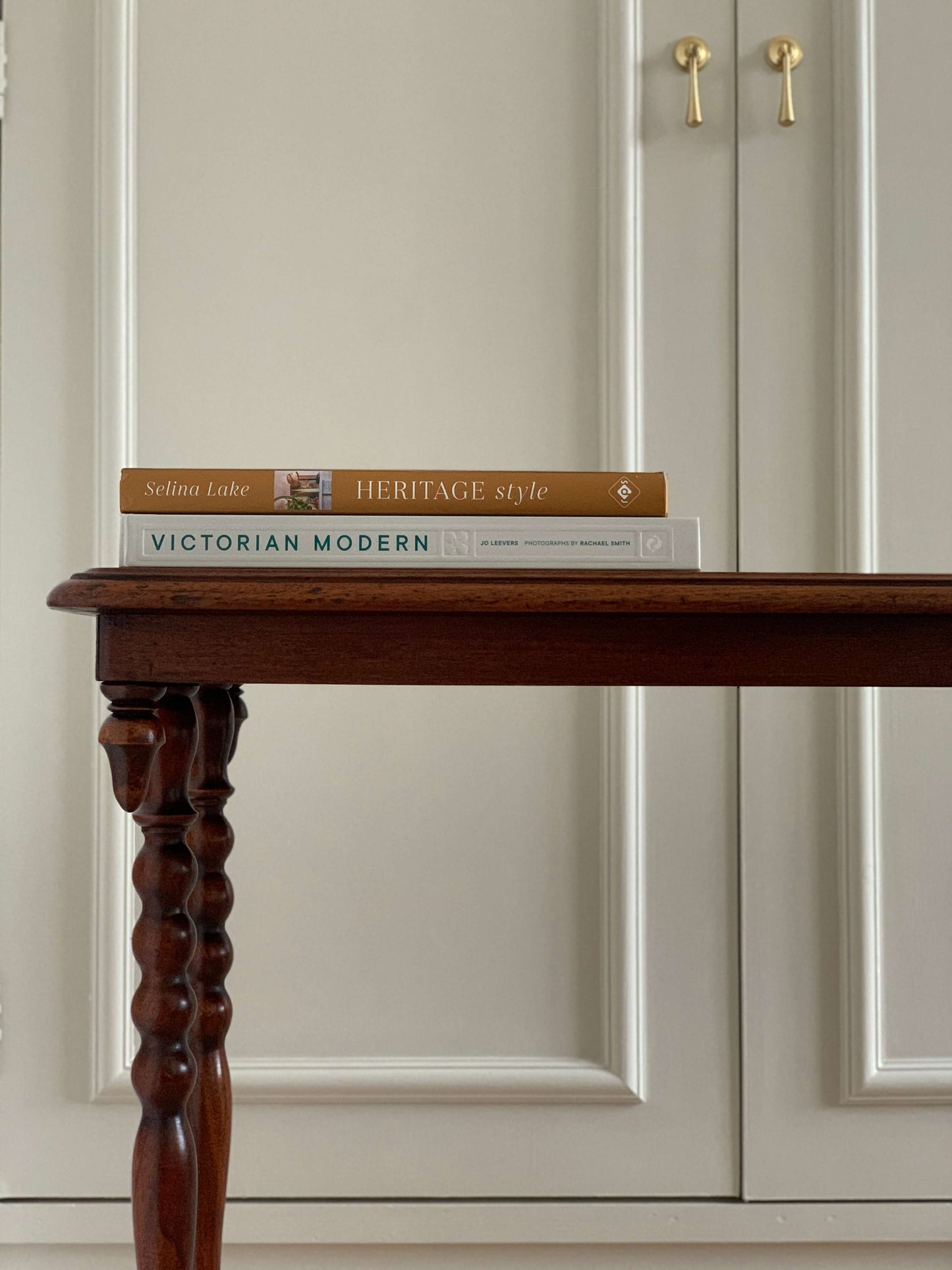 Antique bobbin console table on casters